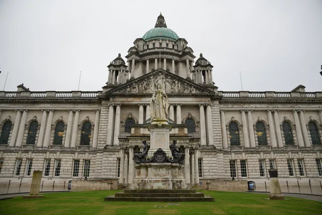 Front view of Belfast City Hall showcasing its architectural grandeur and historic statue. Post-Brexit content marketing agency rules in Belfast